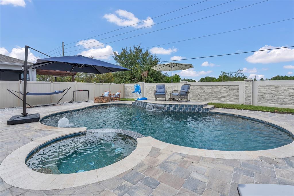2899 Parkfield Road St. Cloud, FL 34772 - Photo 2 of 52 a view of a swimming pool with an outdoor space