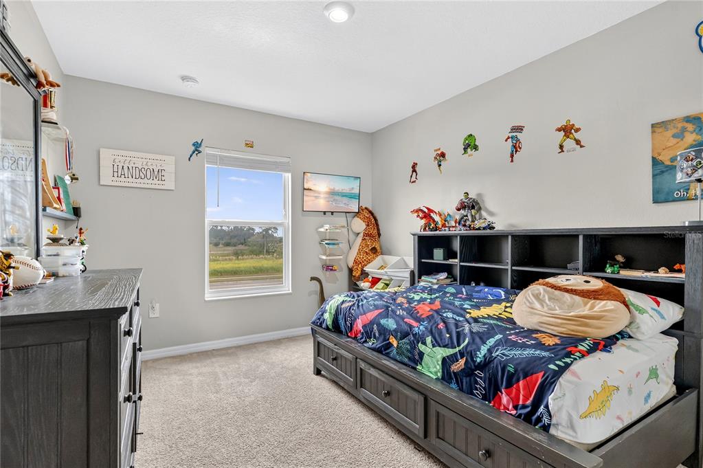 2899 Parkfield Road St. Cloud, FL 34772 - Photo 24 of 52 a bed room with a bed and a window