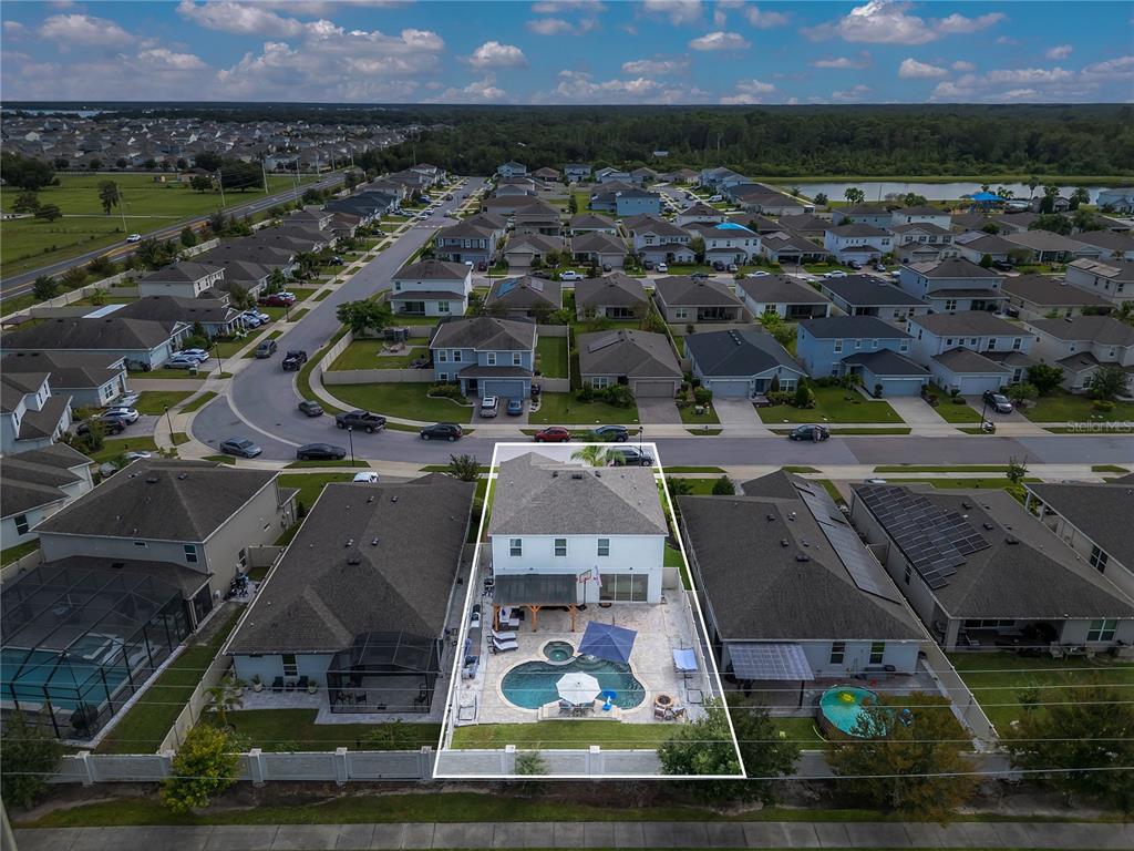 2899 Parkfield Road St. Cloud, FL 34772 - Photo 46 of 52 an aerial view of a house with a garden