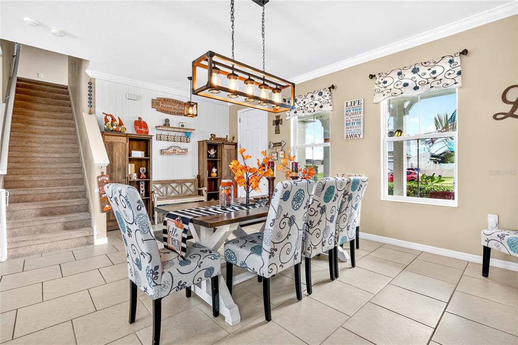 2899 Parkfield Road St. Cloud, FL 34772 - Photo 6 of 52 a view of a dining room with furniture and chandelier