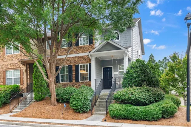 a front view of a house with garden