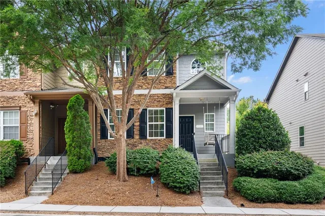 a front view of a house with garden