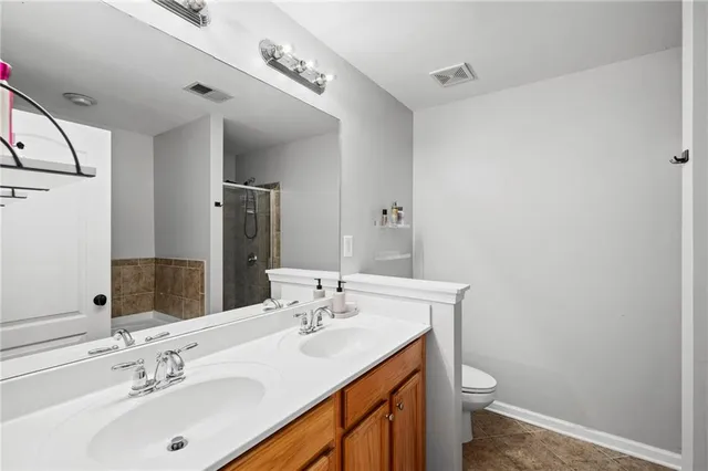 a bathroom with a sink toilet and mirror
