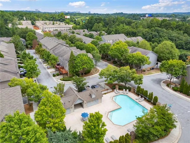 an aerial view of a house with outdoor space