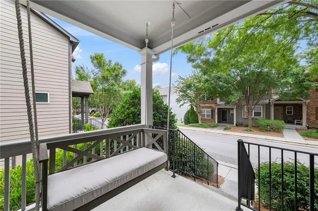 a view of a house with backyard and balcony