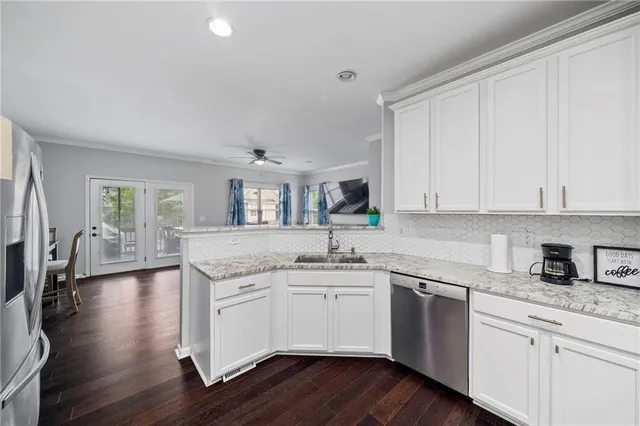 a kitchen with a sink stove and cabinets