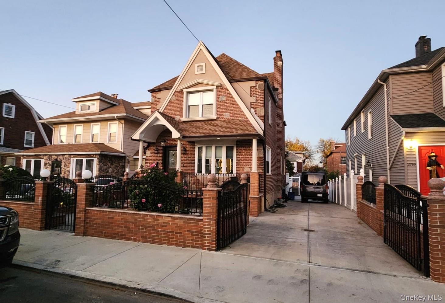 27-15 Butler Street Queens, NY 11369 - Photo 16 of 18 a view of a brick house with many windows