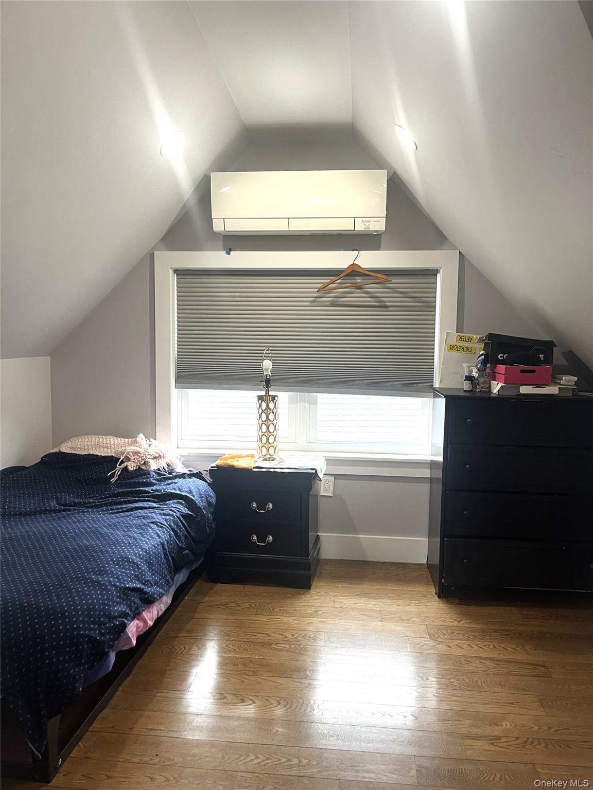 27-15 Butler Street Queens, NY 11369 - Photo 4 of 18 a bedroom with a bed and window
