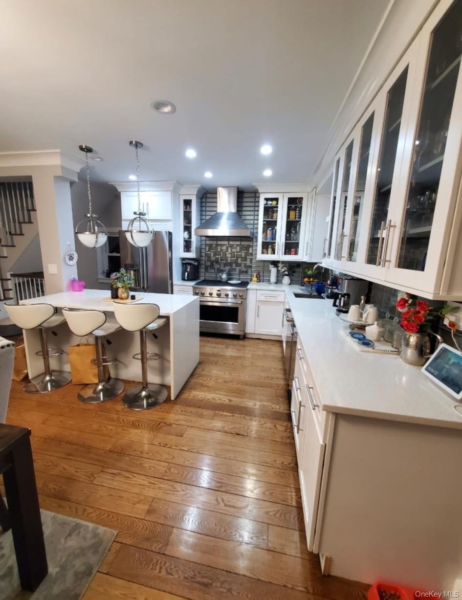 27-15 Butler Street Queens, NY 11369 - Photo 8 of 18 a large kitchen with stainless steel appliances lots of counter top space
