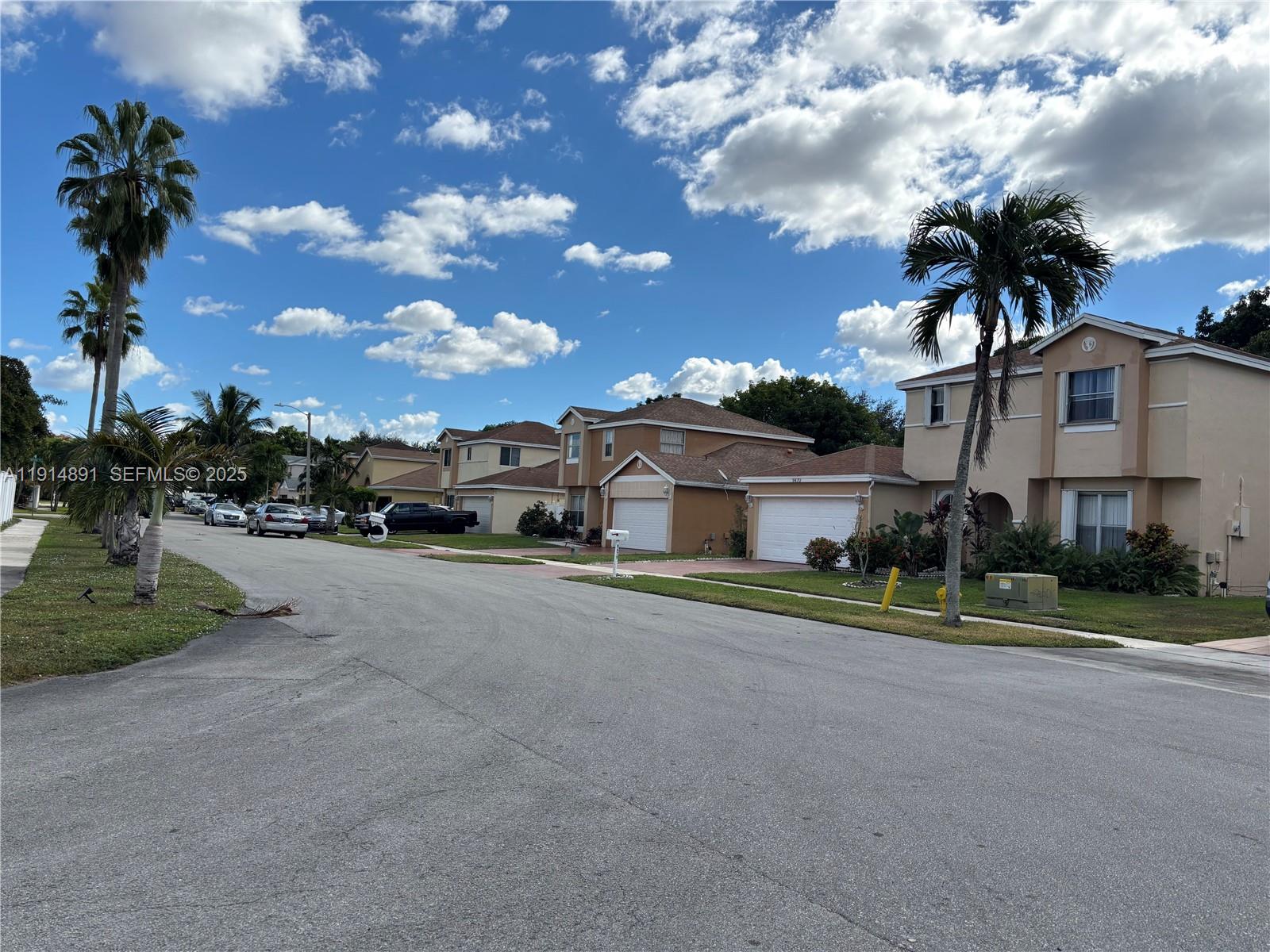 9470 Atlantic Street Miramar, FL 33025 - Photo 4 of 7 a front view of a house with a yard and garage