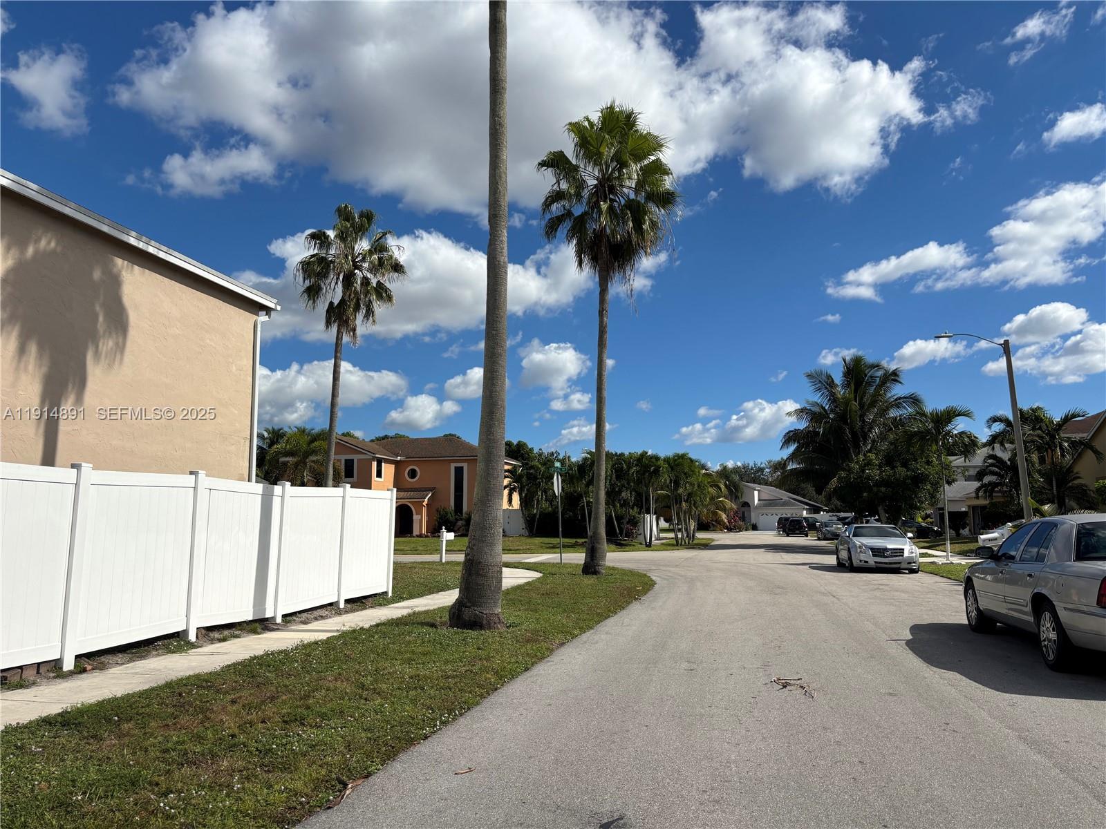 9470 Atlantic Street Miramar, FL 33025 - Photo 7 of 7 a view of a street with cars