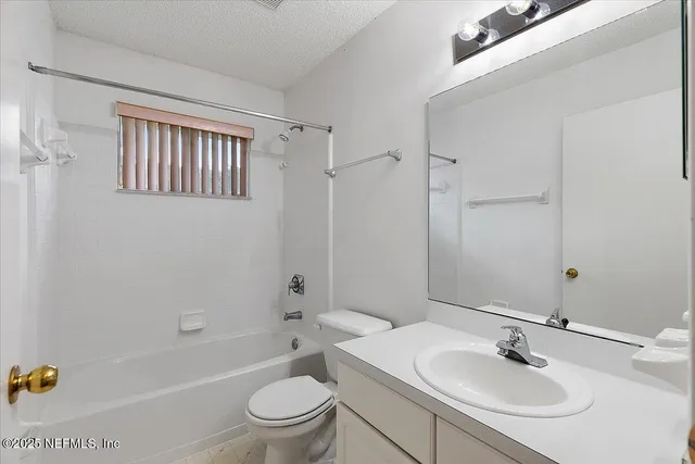 a bathroom with a sink toilet a tub and shower