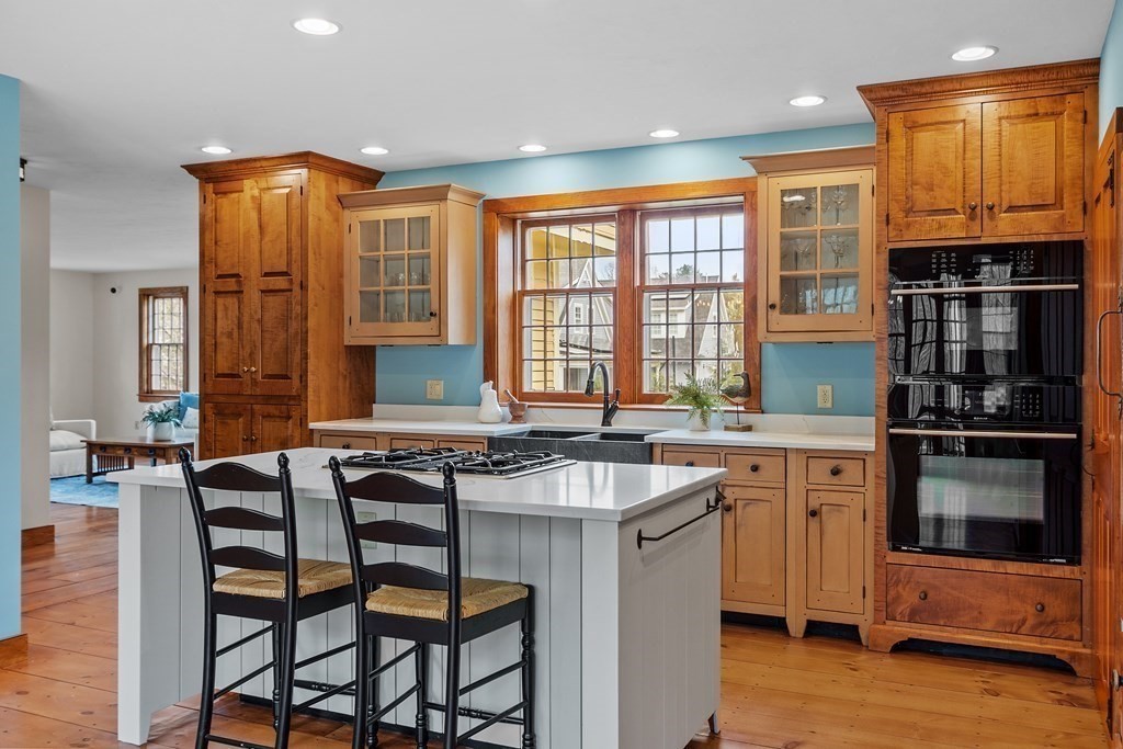 24 Rocky Dundee Road Bolton, MA 01740 - Photo 8 of 35 a kitchen with a table chairs sink and cabinets