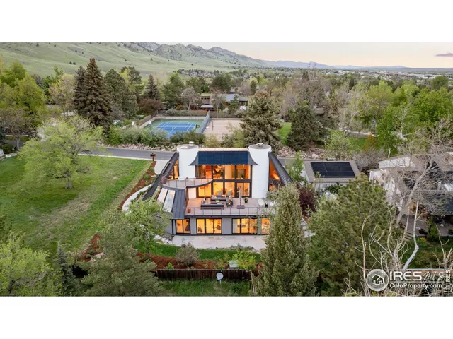 a aerial view of a house with a yard