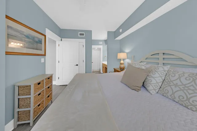 a bedroom with a bed and a cabinets