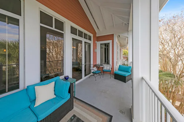a view of an outdoor sitting area with brick walls