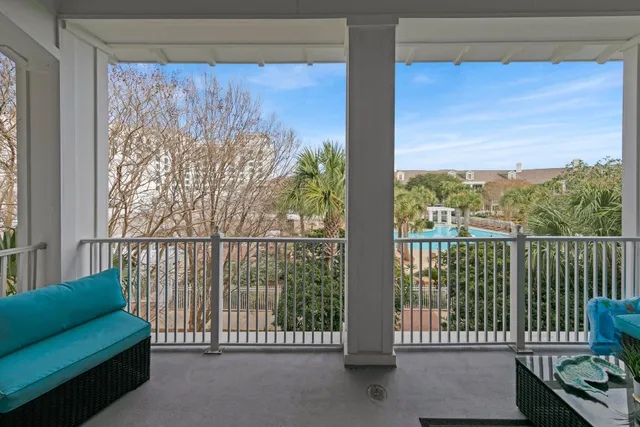 a view of a balcony with furniture