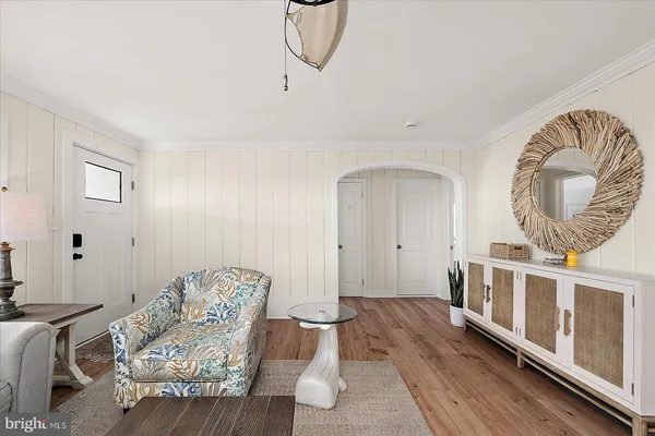 a kitchen with stainless steel appliances white cabinets and a stove top oven