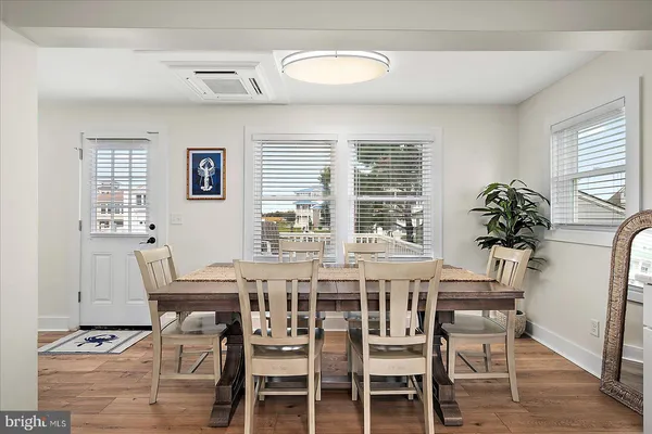 a bathroom with a shower sink and mirror