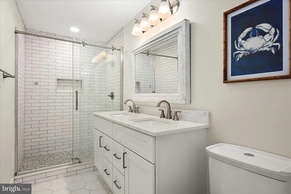 a bathroom with a shower and a sink