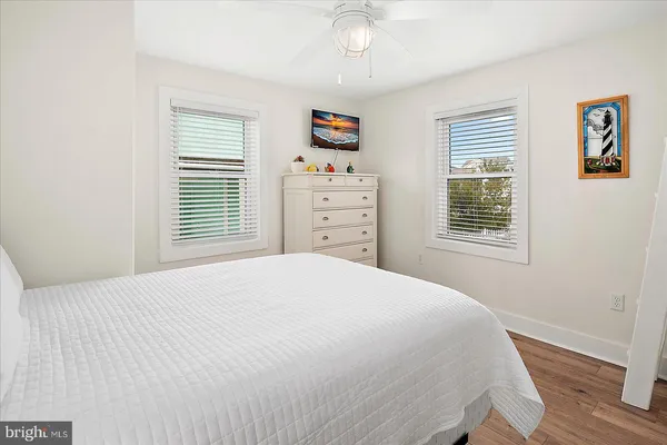a front view of a house with a garden and plants