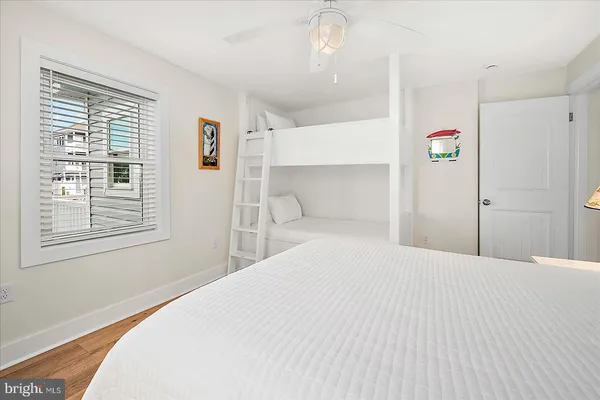 a view of a porch with chairs and flower plants