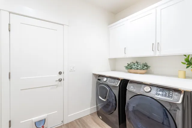 a utility room with dryer and washer