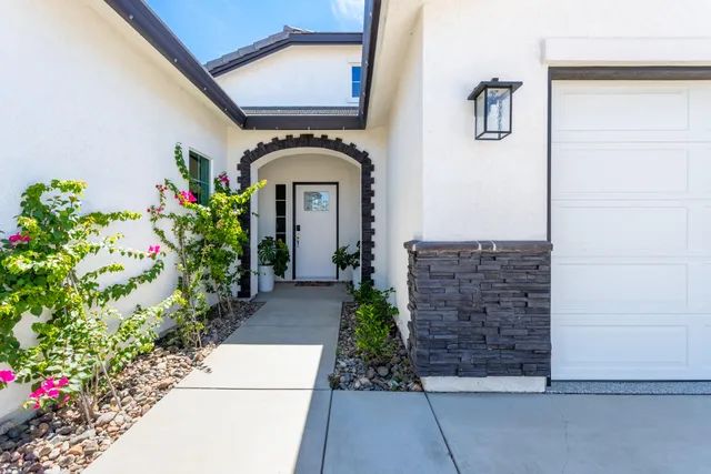 a front view of a house with a pathway