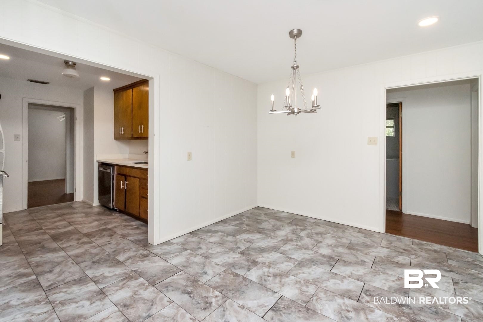 5412 South Norden Drive Mobile, AL 36608 - Photo 19 of 38 Unfurnished dining area with a notable chandelier