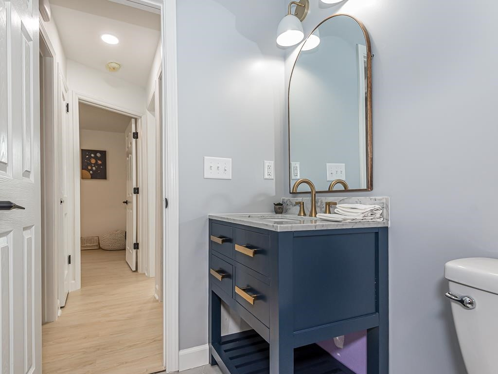1703 Patton Road Raleigh, NC 27608 - Photo 15 of 30 a bathroom with a sink vanity granite and a mirror