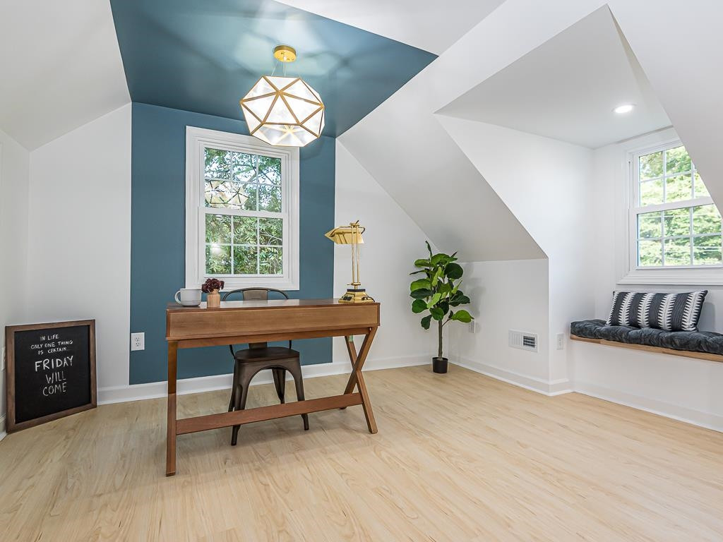 1703 Patton Road Raleigh, NC 27608 - Photo 20 of 30 a view of a livingroom with furniture window and wooden floor