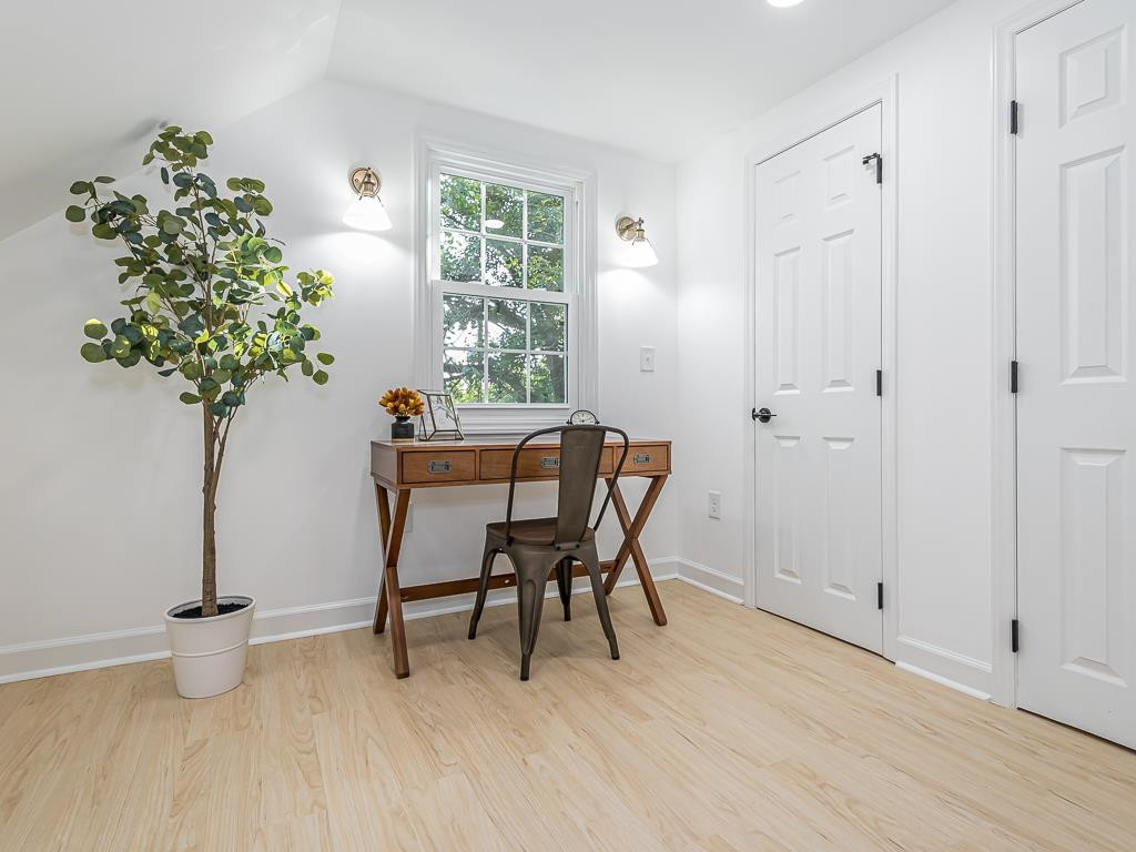 1703 Patton Road Raleigh, NC 27608 - Photo 22 of 30 a view of a room with furniture and a potted plant