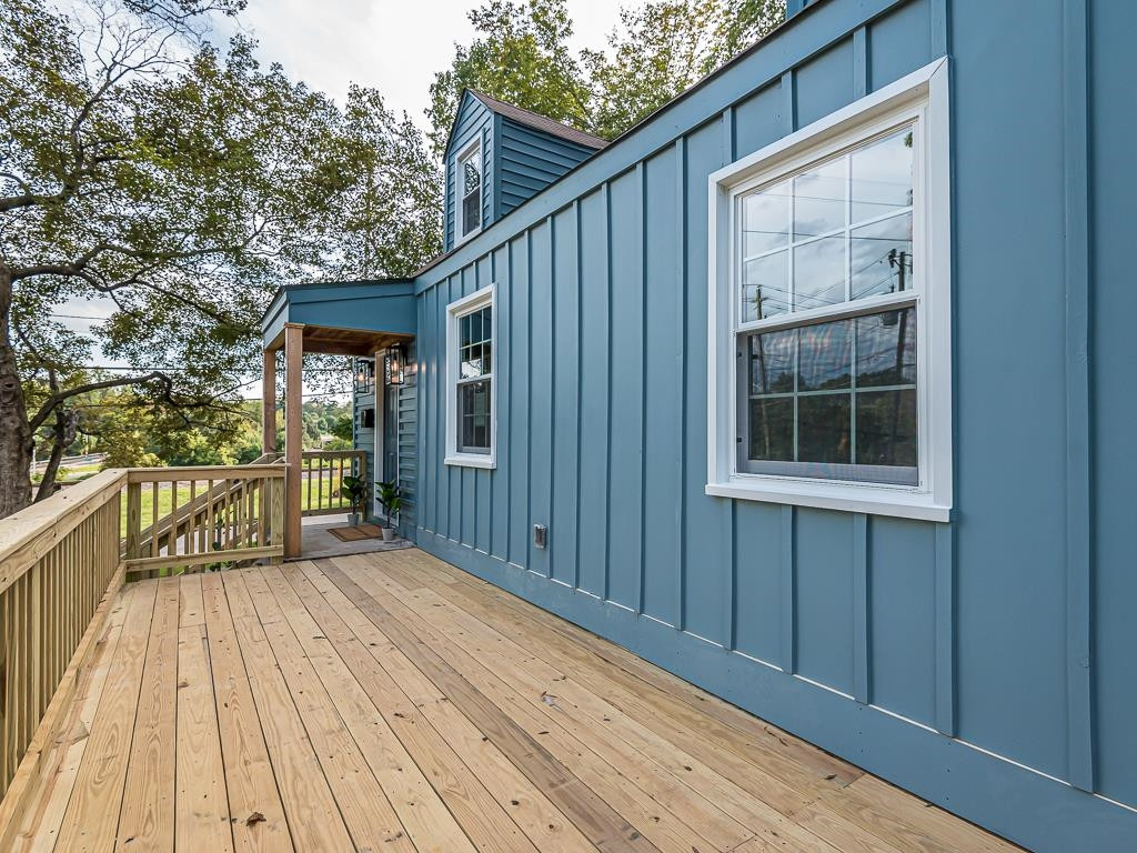 1703 Patton Road Raleigh, NC 27608 - Photo 29 of 30 a view of backyard with a deck and wooden floor