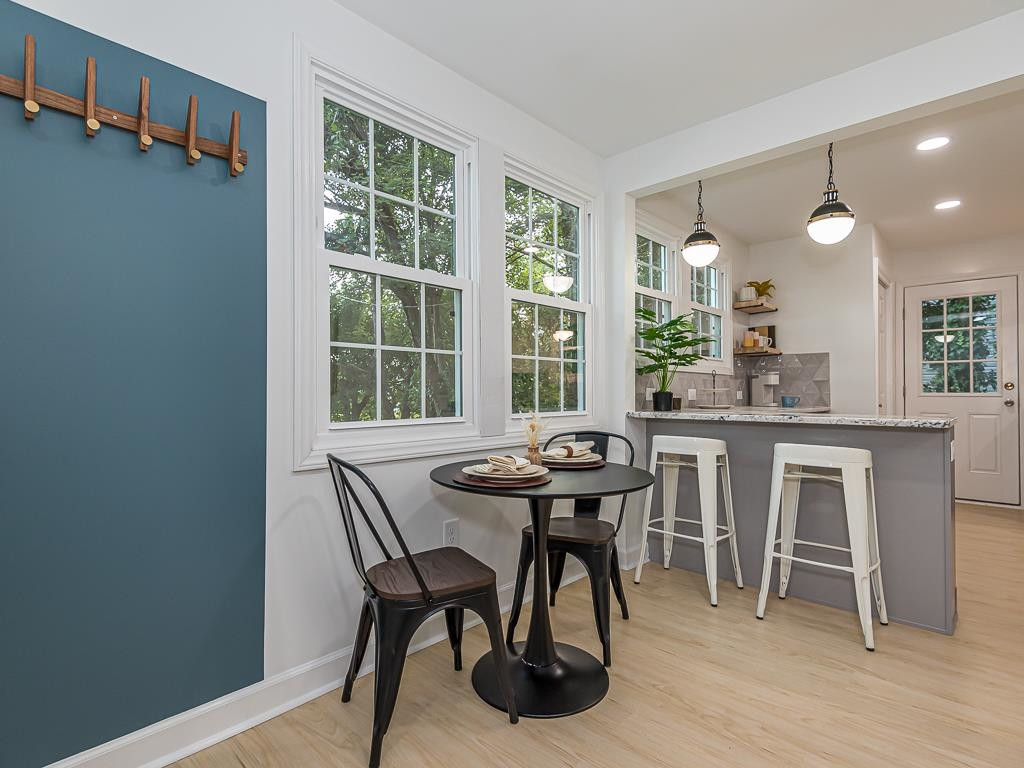 1703 Patton Road Raleigh, NC 27608 - Photo 8 of 30 a view of a dining room with a table and chairs