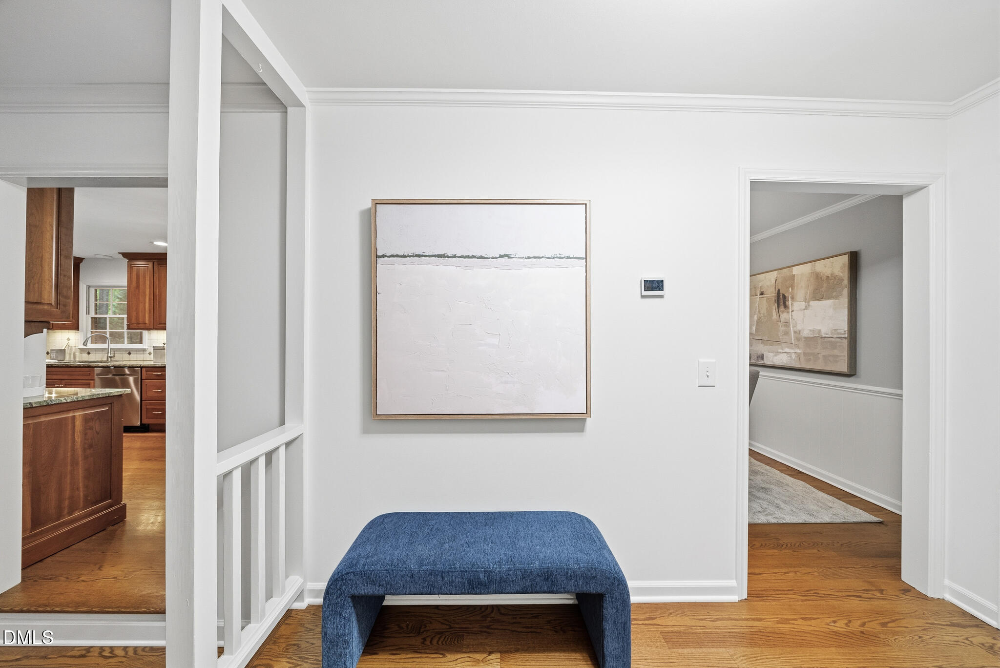 3404 Timberwood Court Raleigh, NC 27606 - Photo 2 of 45 a view of a hallway with wooden floor and a living room