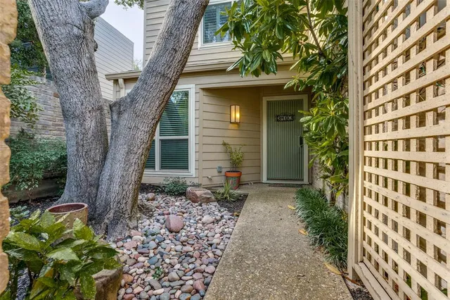 front view of a house with a garden