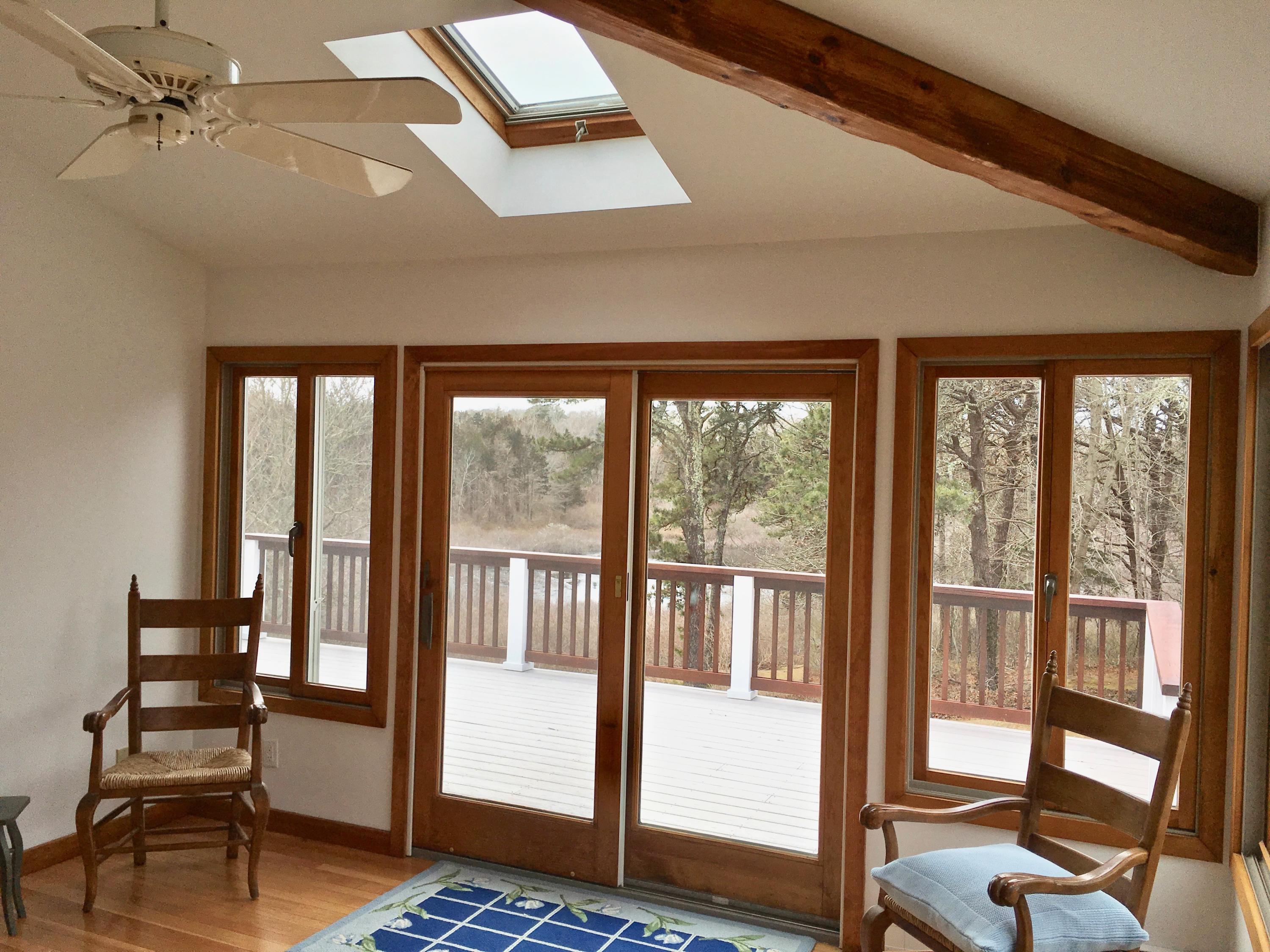 26 Champlain Road Orleans, MA 02653 - Photo 12 of 32 a view of a livingroom with couch and floor to ceiling window