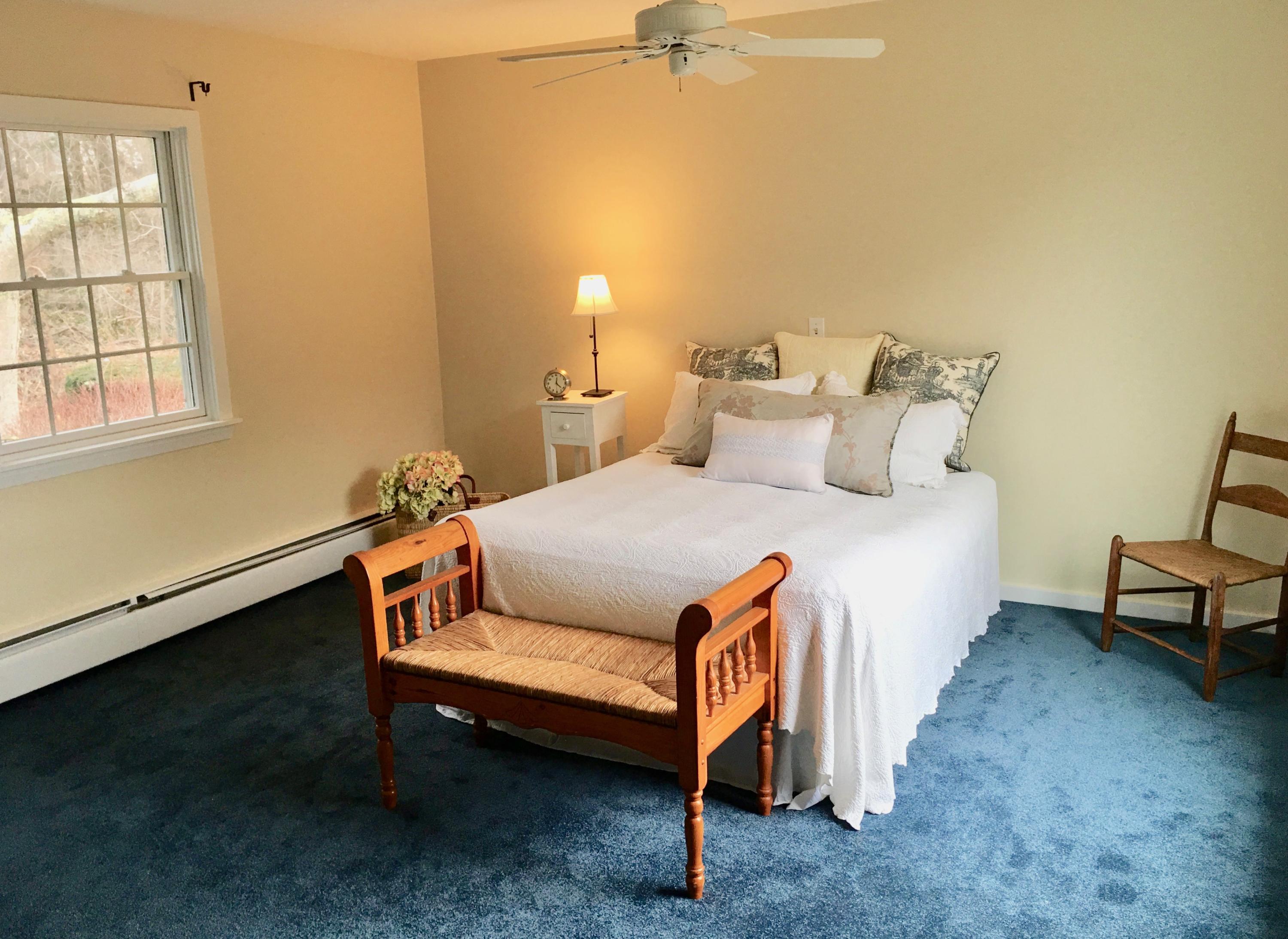 26 Champlain Road Orleans, MA 02653 - Photo 14 of 32 a room with a bed and a window