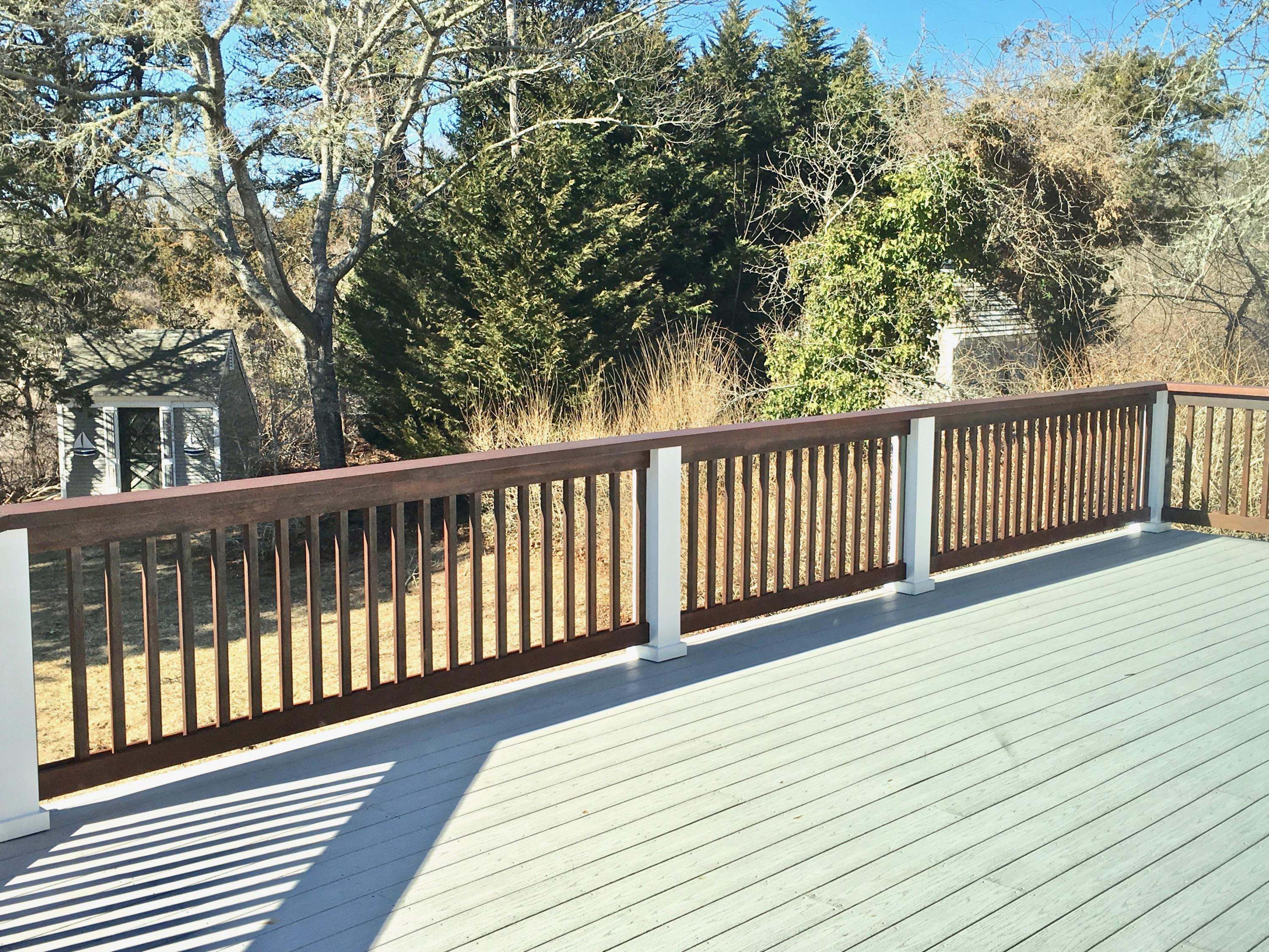 26 Champlain Road Orleans, MA 02653 - Photo 29 of 32 a balcony with wooden floor and fence