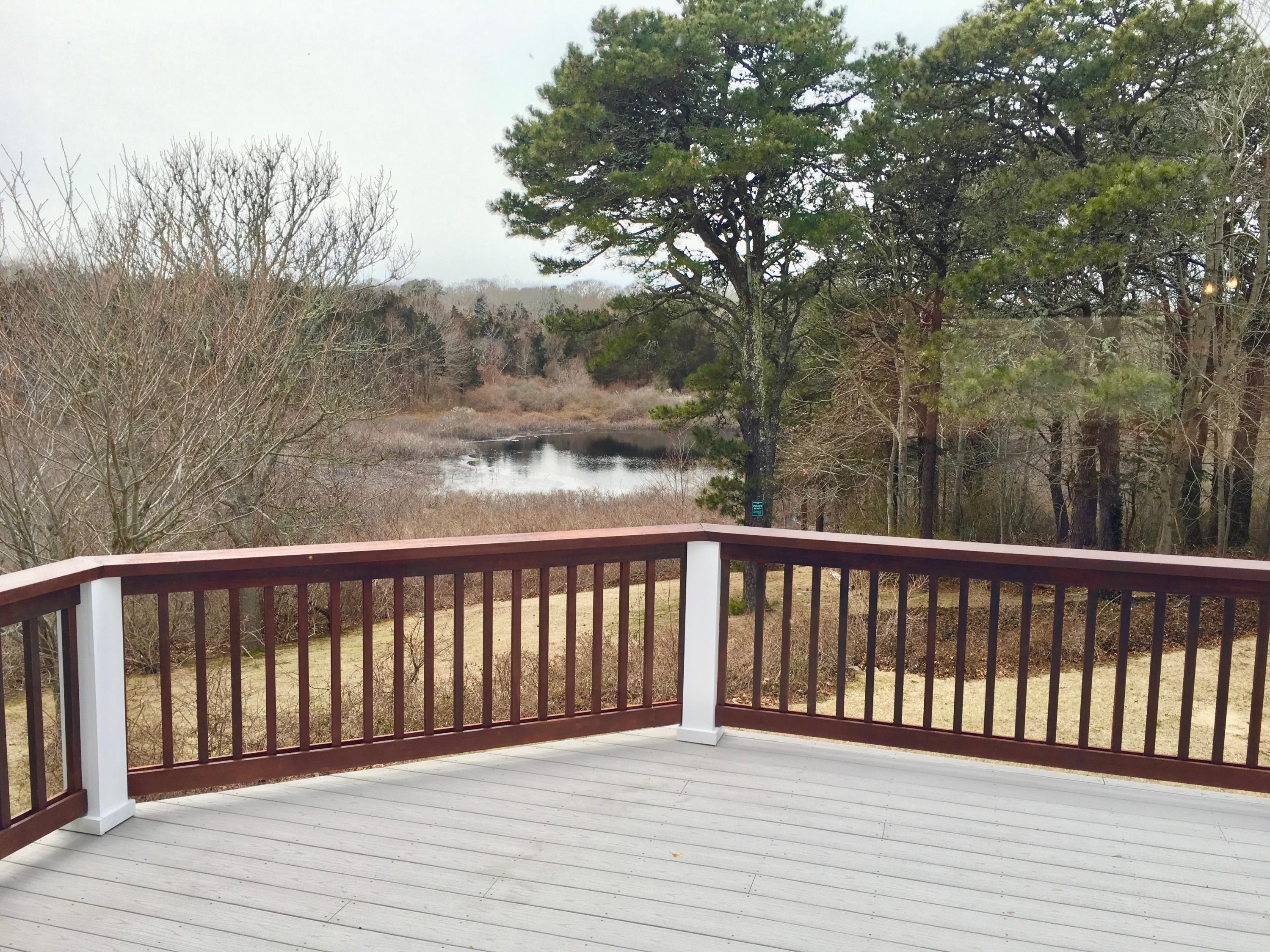 26 Champlain Road Orleans, MA 02653 - Photo 30 of 32 a view of balcony with wooden floor