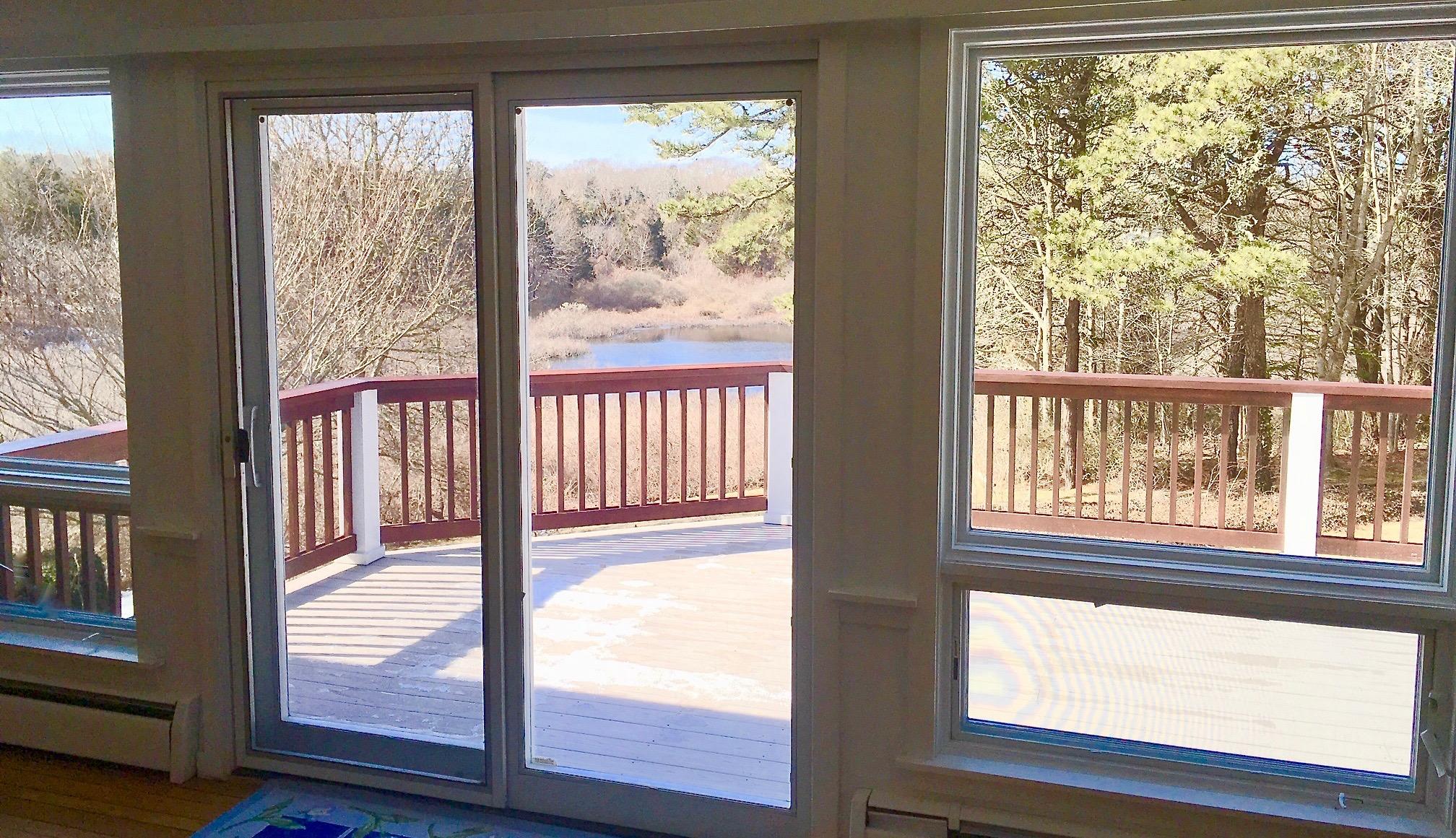 26 Champlain Road Orleans, MA 02653 - Photo 3 of 32 a view of a large window with wooden floor