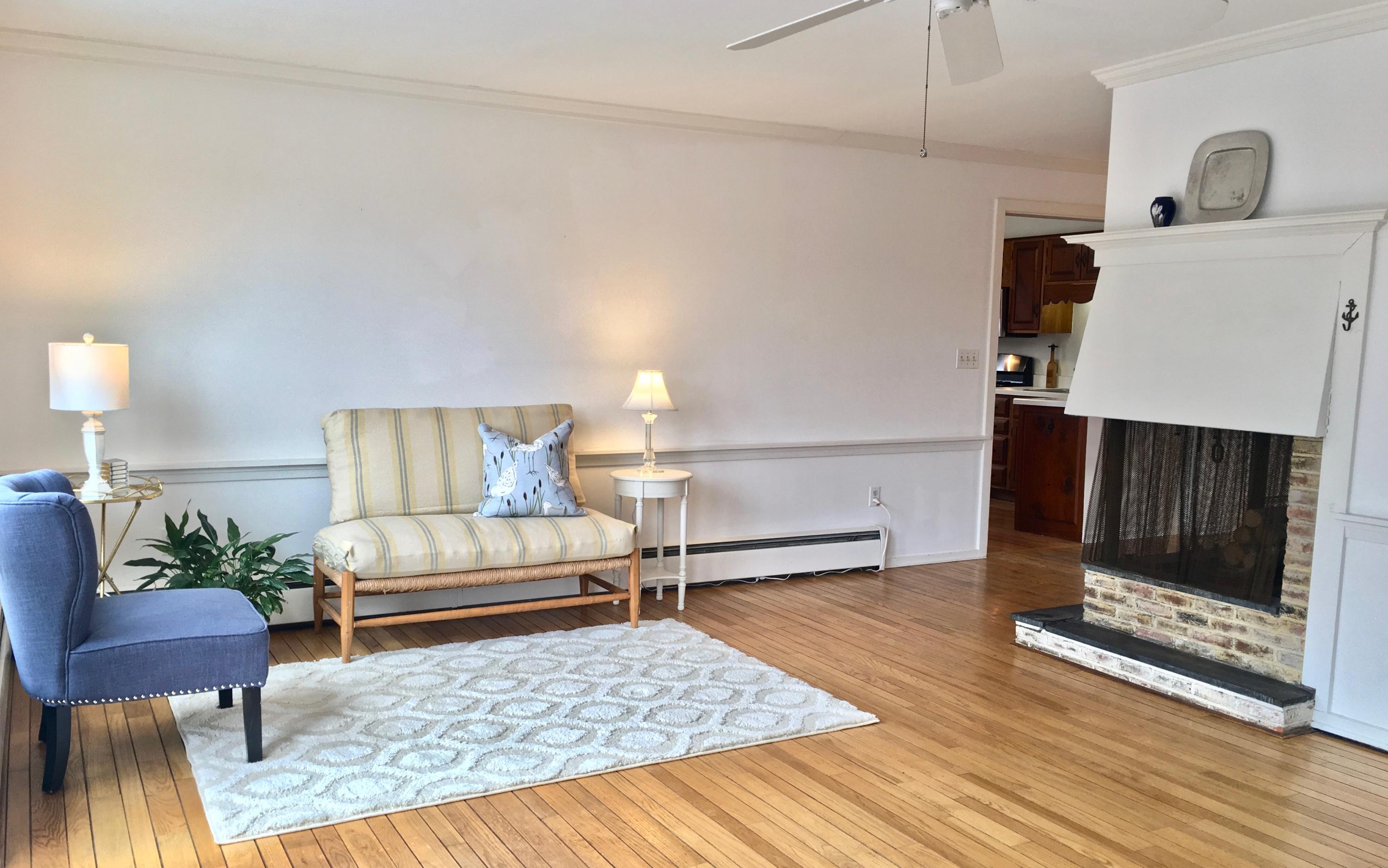 26 Champlain Road Orleans, MA 02653 - Photo 5 of 32 a living room with furniture and a rug