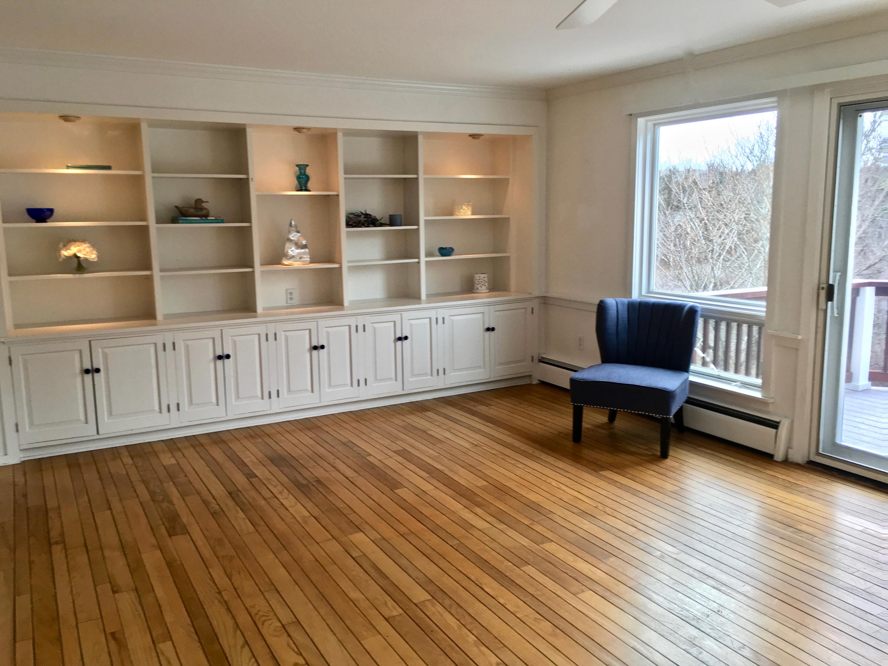 26 Champlain Road Orleans, MA 02653 - Photo 6 of 32 a view of a livingroom with furniture and wooden floor