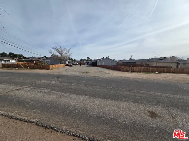 a view of a road with houses