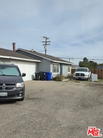 a view of a car parked in front of a house