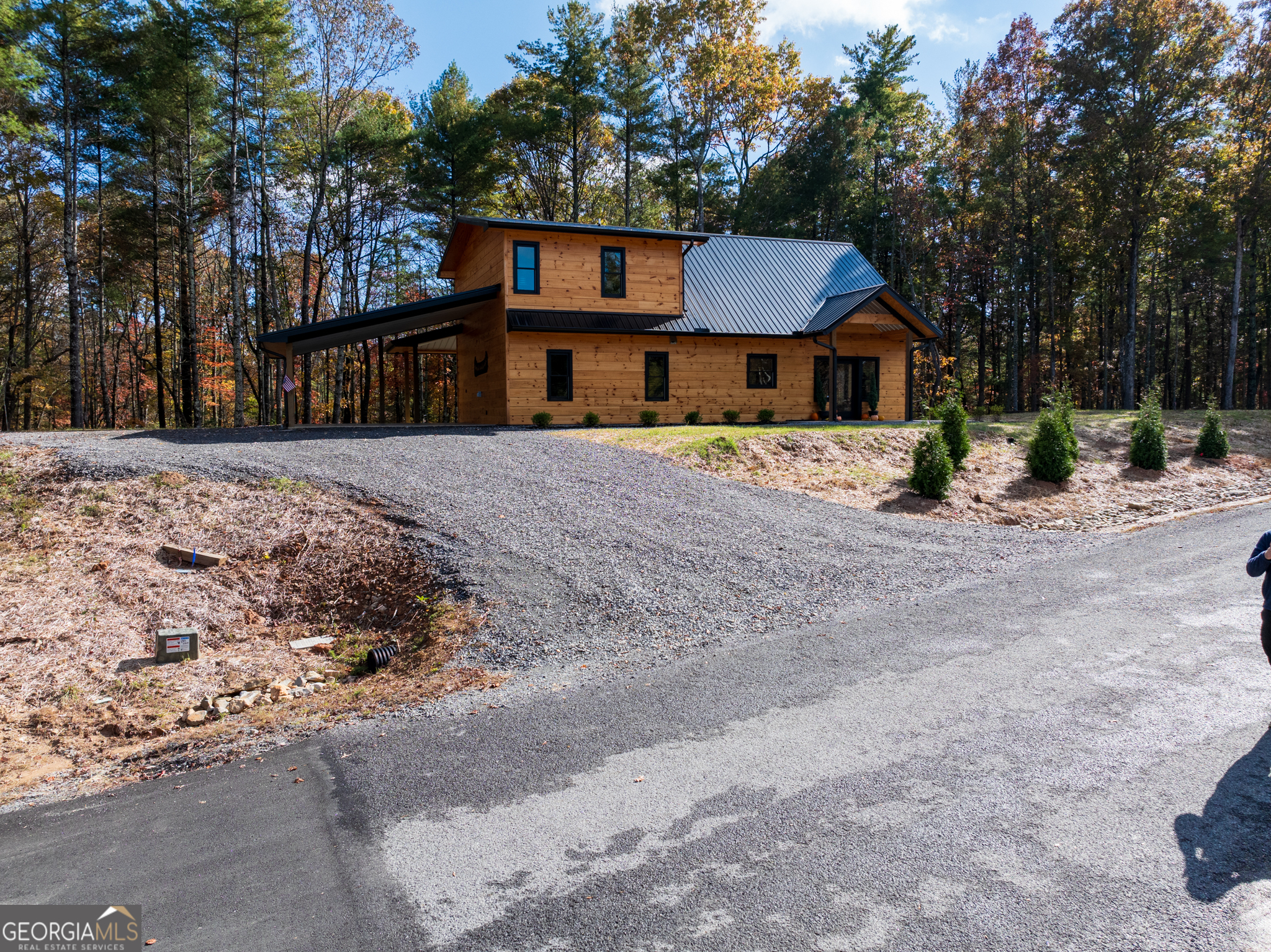0 Ridge Road Morganton, GA 30560 - Photo 12 of 47 a front view of a house with a yard and garage