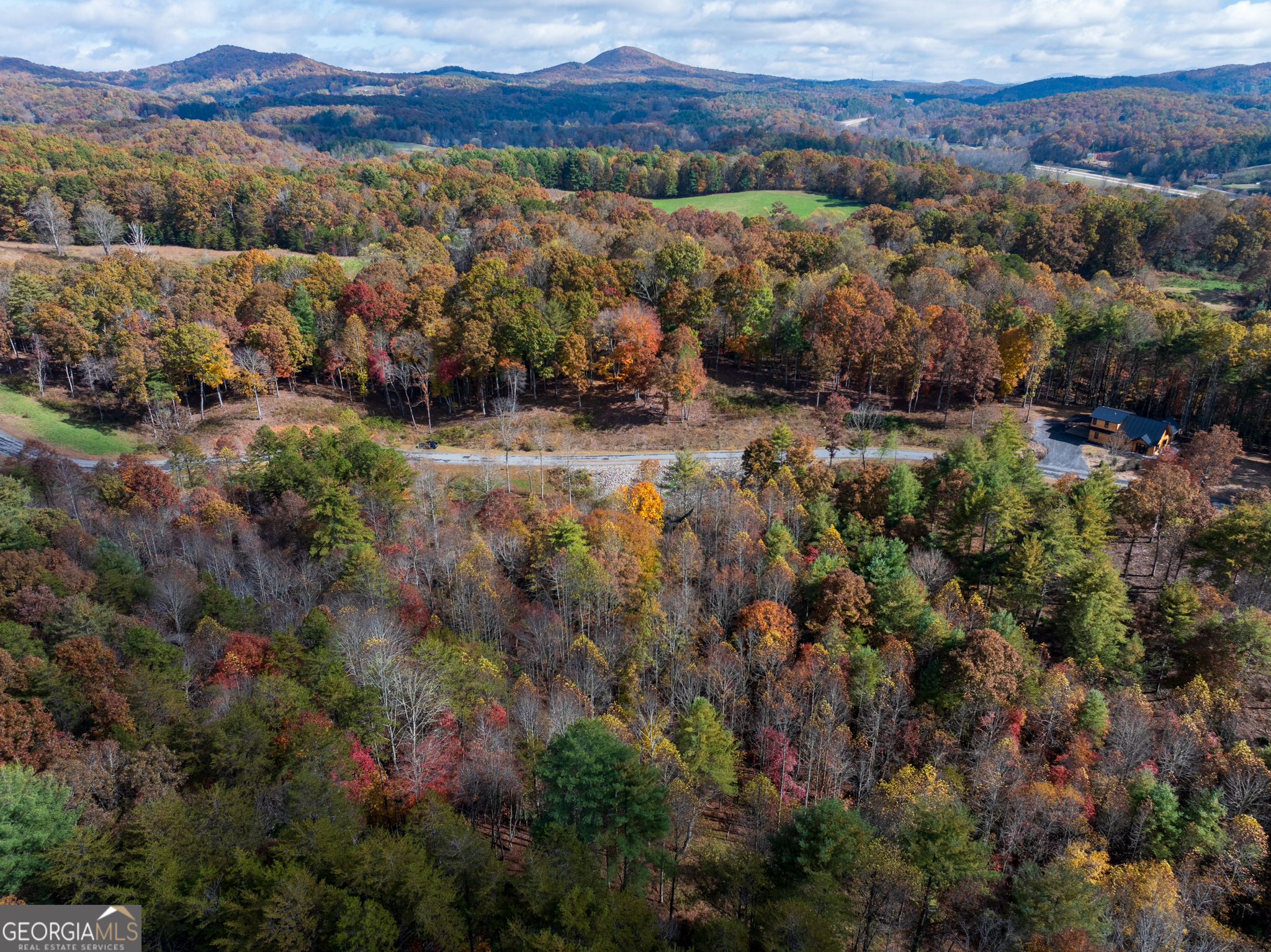 0 Ridge Road Morganton, GA 30560 - Photo 3 of 47 an aerial view of green landscape with trees houses and mountain view