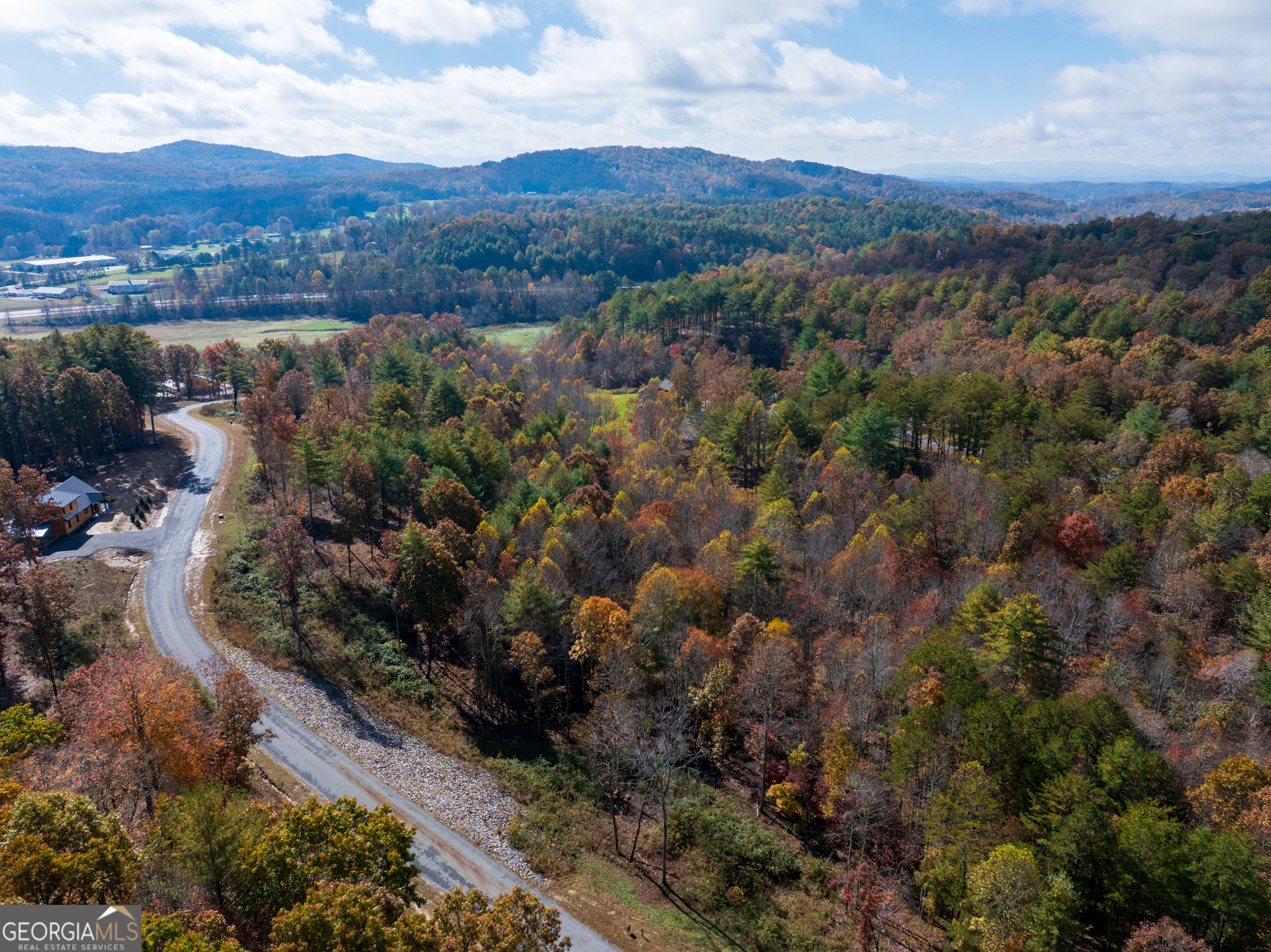 0 Ridge Road Morganton, GA 30560 - Photo 33 of 47 an aerial view of green landscape with trees houses and mountain view