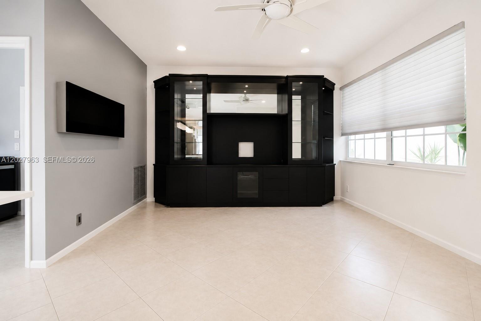 6646 Northwest 25th Terrace Boca Raton, FL 33496 - Photo 15 of 48 a living room with flat screen tv