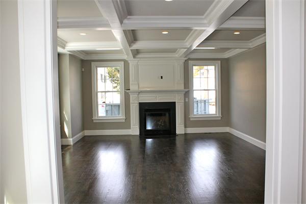 4 Claflin Road Wellesley, MA 02482 - Photo 5 of 20 an empty room with wooden floor fireplace and windows